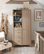 Oak-finish wardrobe with open shelves, hanging space, and three lower drawers
