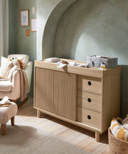 Oak wide dresser changer with fluted side panels and three front drawers