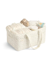 Beige leaf-pattern nappy caddy with padded sides, open top organizer and handles