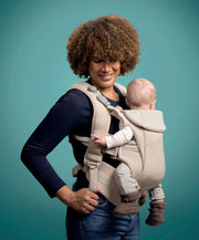 Cashmere baby carrier, beige, front-facing with padded shoulder straps and leg support