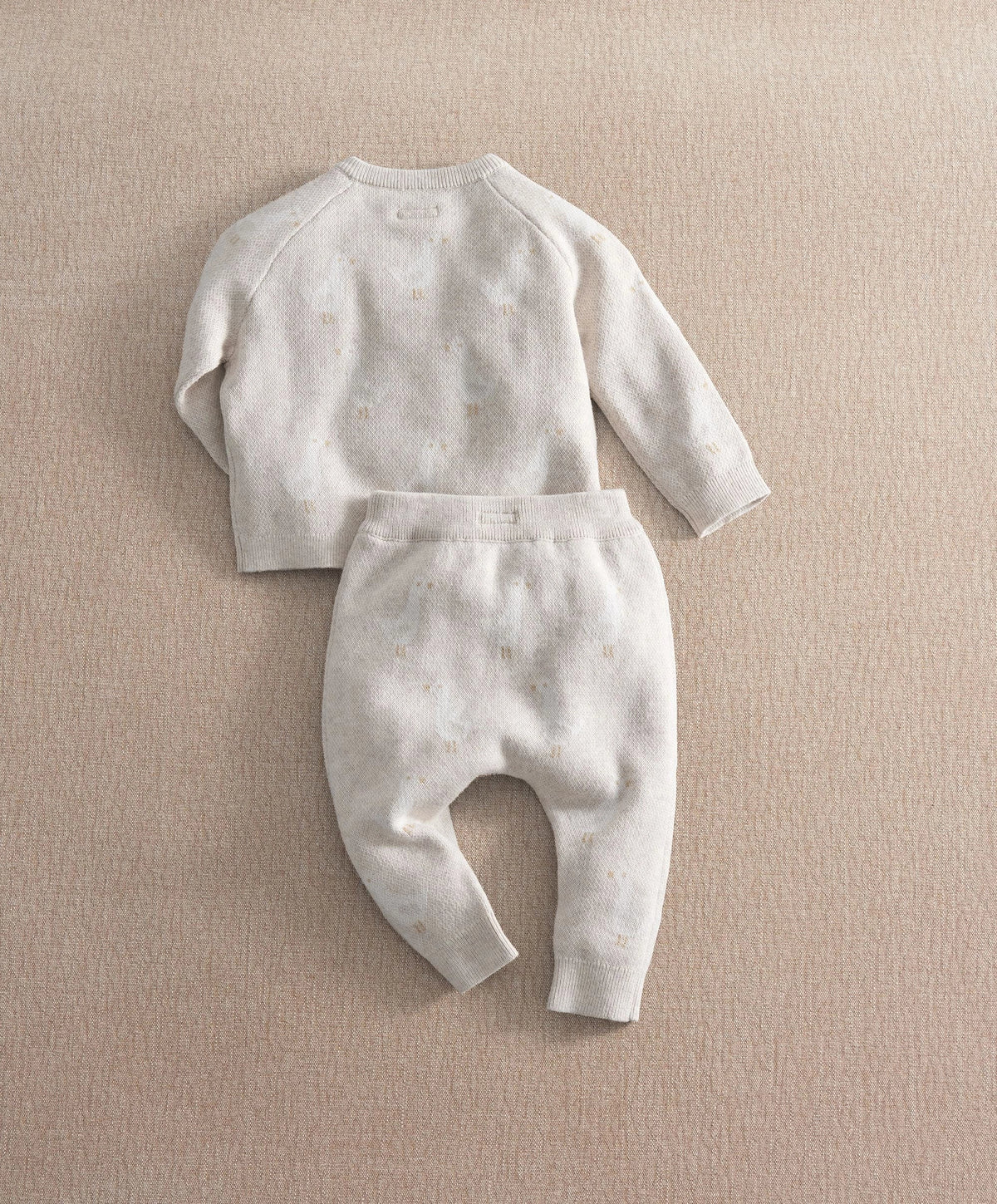 Cream duck-knit 2-piece set, speckle pattern: long-sleeve top with matching cuffed pants.