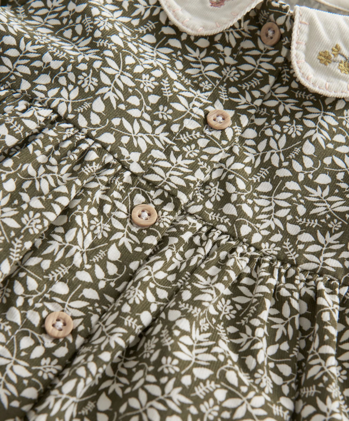 Leaf print long-sleeve dress with gathered skirt and wooden button details