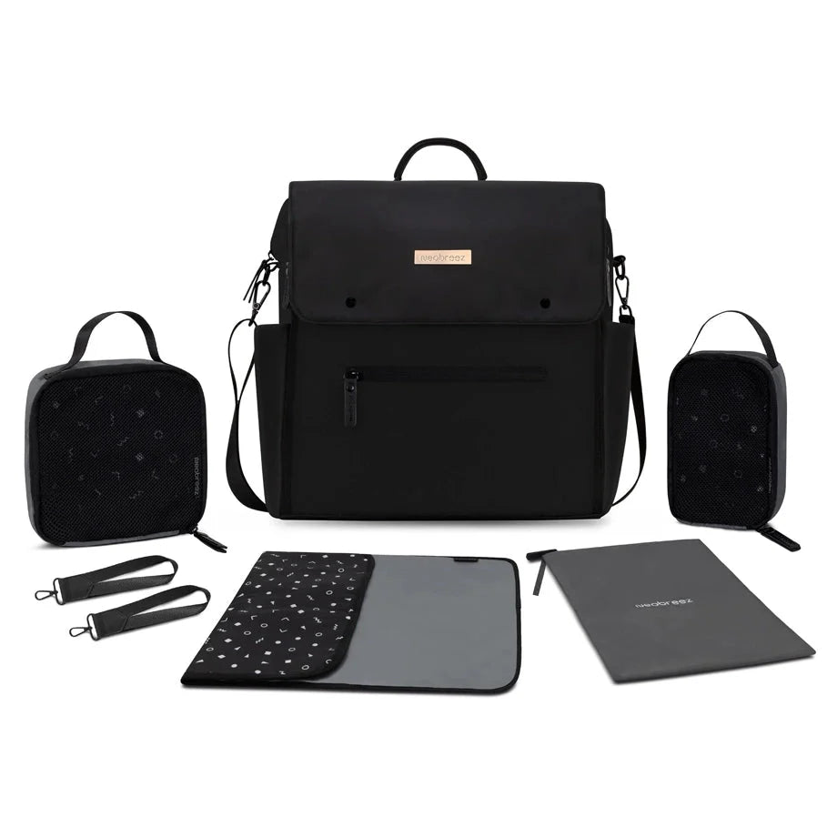 Black changing backpack with front flap, side pockets, and included changing accessories