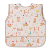 Light pink kids’ apron with colorful farm icons and front pocket