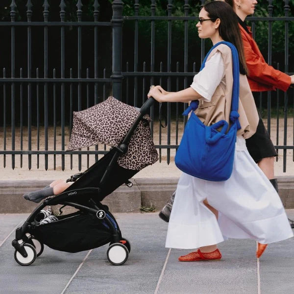 Leopard stroller cover set on a compact stroller with canopy and seat pad