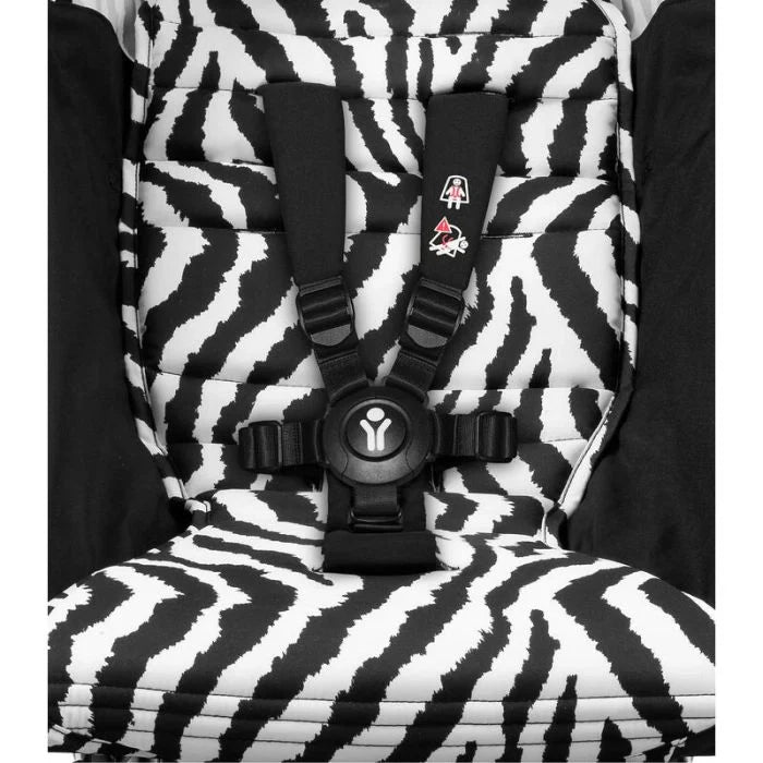 Zebra print stroller seat insert with harness pads and central chest clip