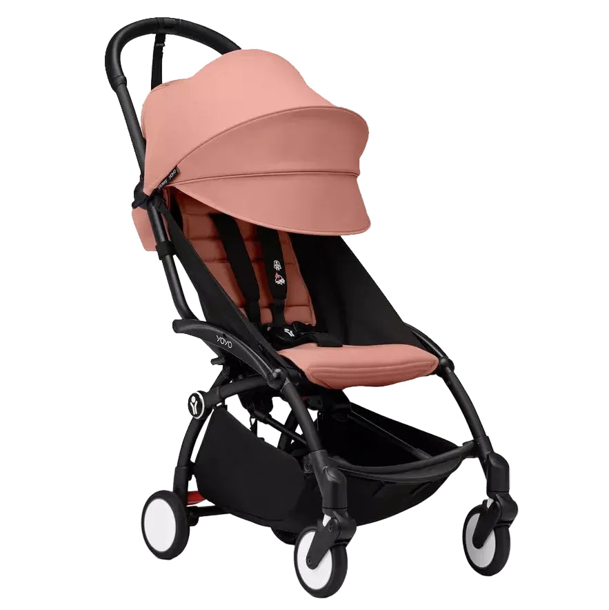 Infant stroller with ginger-pink seat and black frame