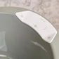 White digital thermometer control panel with buttons on curved housing