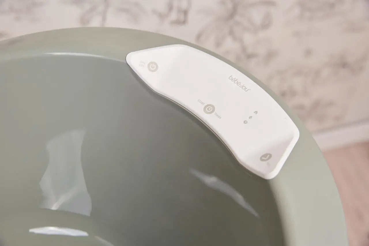 White digital thermometer control panel with buttons on curved housing
