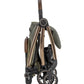 Folded pushchair stroller with olive seat and tan frame, compact wheel view