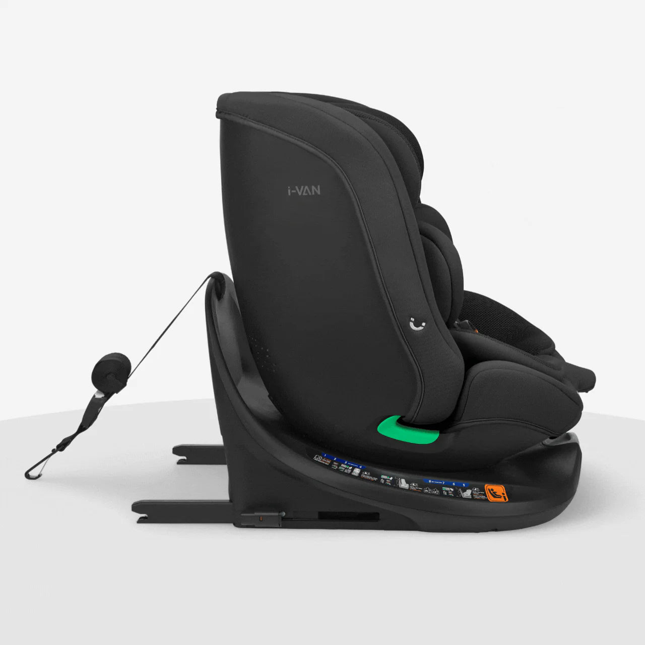 Black car seat with side-impact wings, green accent pad, and recline foot support
