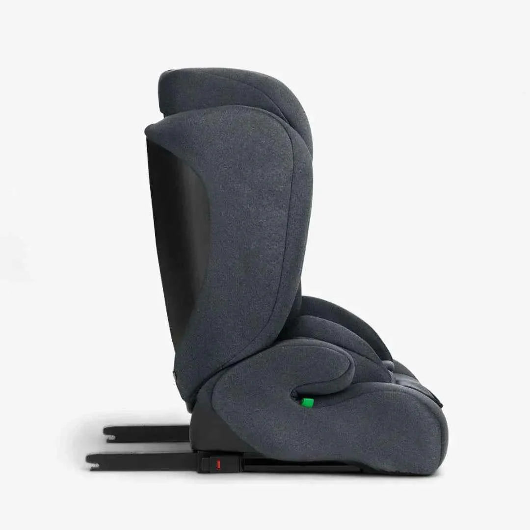 Dark grey car seat rear side view with recline base and padded headrest