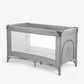 Grey 2-level baby cot with mesh side panels and low curved legs
