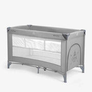 Grey 2-level baby cot with open mesh sides and padded top rail