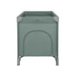 Green baby cot with padded top corners and solid front panel
