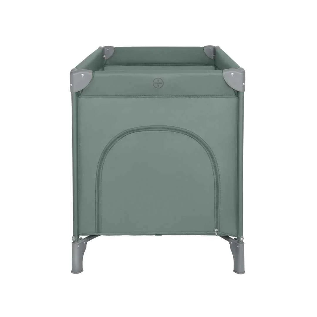 Green baby cot with padded top corners and solid front panel