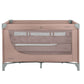 Pink 2-level baby cot with open mesh side, padded top rail and gray legs