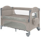 Beige two-level baby cot with two-level fabric mattress pads and mesh windows