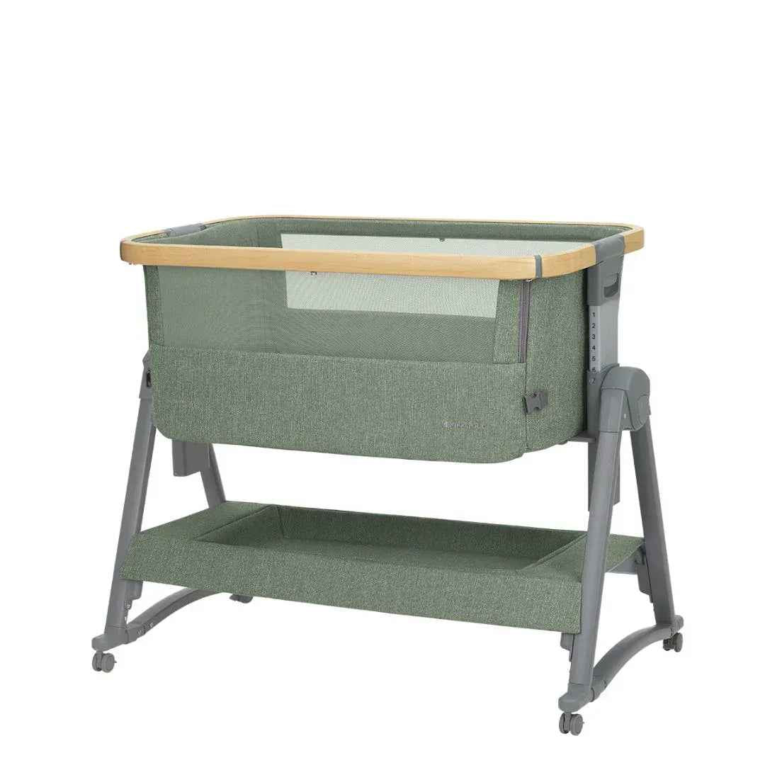 Army green bedside crib with open view, white mesh panel, wooden top rail, casters