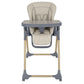 Beige high chair with padded back and seat, blue base, safety bar and tray