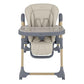 Beige high chair front view with clear tray, padded inserts, and blue leg frame