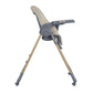 Beige high chair in angled side view with tray, harness, and light wood legs