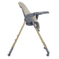 Beige high chair side view with footrest, tray, harness, and caster wheels