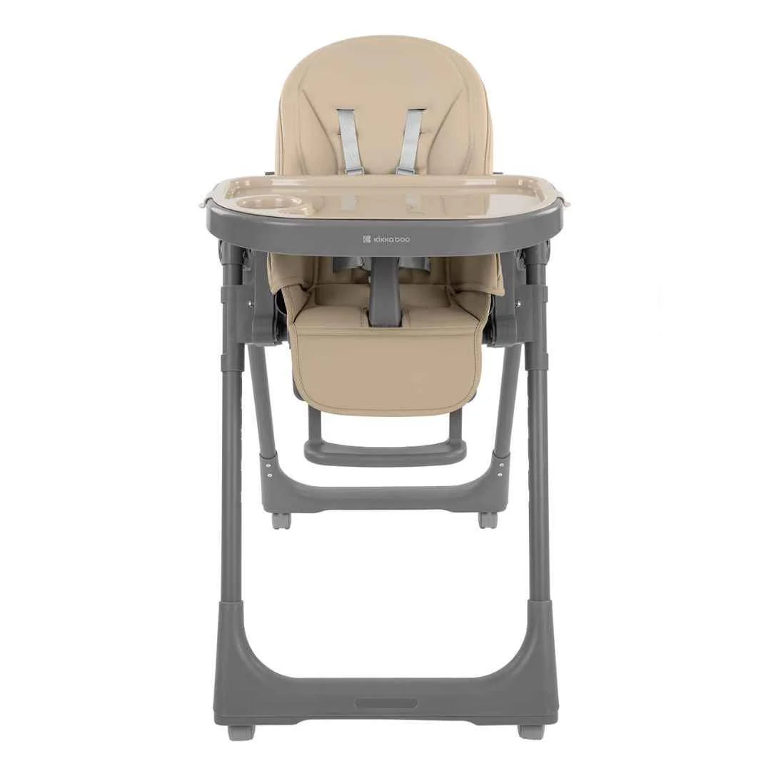 Beige high chair with round tray, padded seat insert, and gray legs