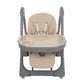 Beige high chair with full seat pad, harness straps, and overhead armrests