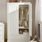 Off-white nursery wardrobe with open doors showing hanging clothes and shelves