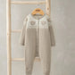 Light beige knitted romper with round neck, long sleeves, button front, teddy knit panel