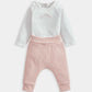 White bodysuit top with pink striped leggings and elastic cuffed ankles