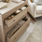 Oak dresser changer with open drawer compartments for storage under the top