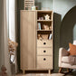 Oak wardrobe with ribbed panel doors, open shelves, and three drawer fronts