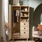 Oak wardrobe with ribbed doors, open shelving, and hanging clothes inside