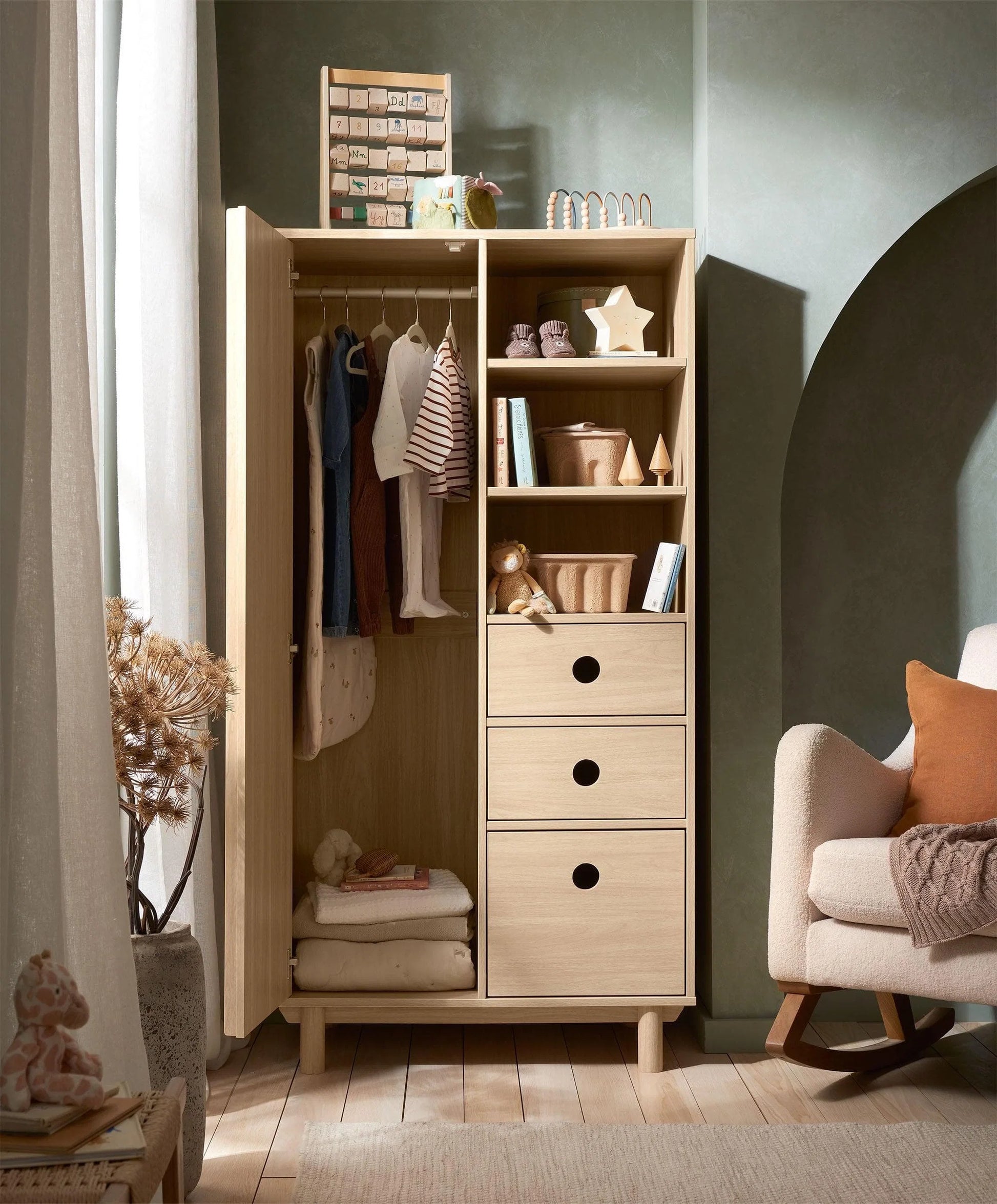 Oak wardrobe with ribbed doors, open shelving, and hanging clothes inside