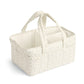 Beige leaf-pattern nappy caddy tote with two loop handles and divided interior storage