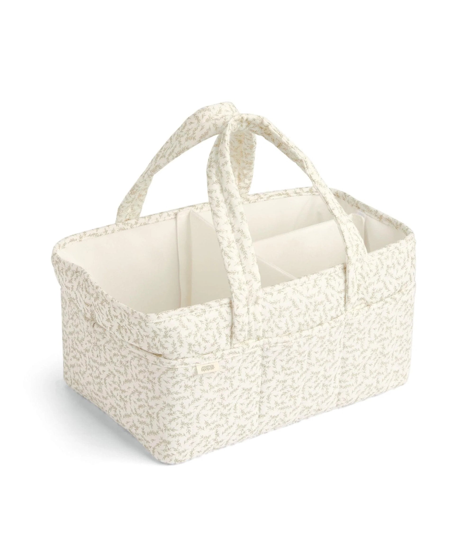 Beige leaf-pattern nappy caddy tote with two loop handles and divided interior storage