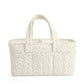 Beige leaf-pattern nappy caddy with wide handles and structured interior base