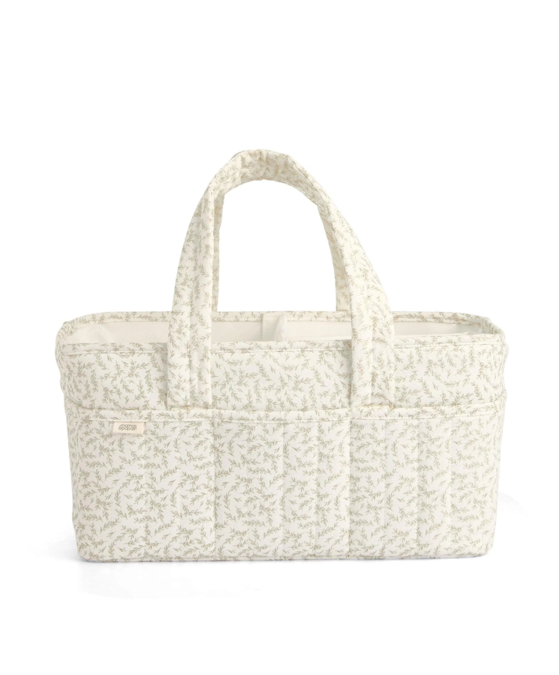 Beige leaf-pattern nappy caddy with wide handles and structured interior base