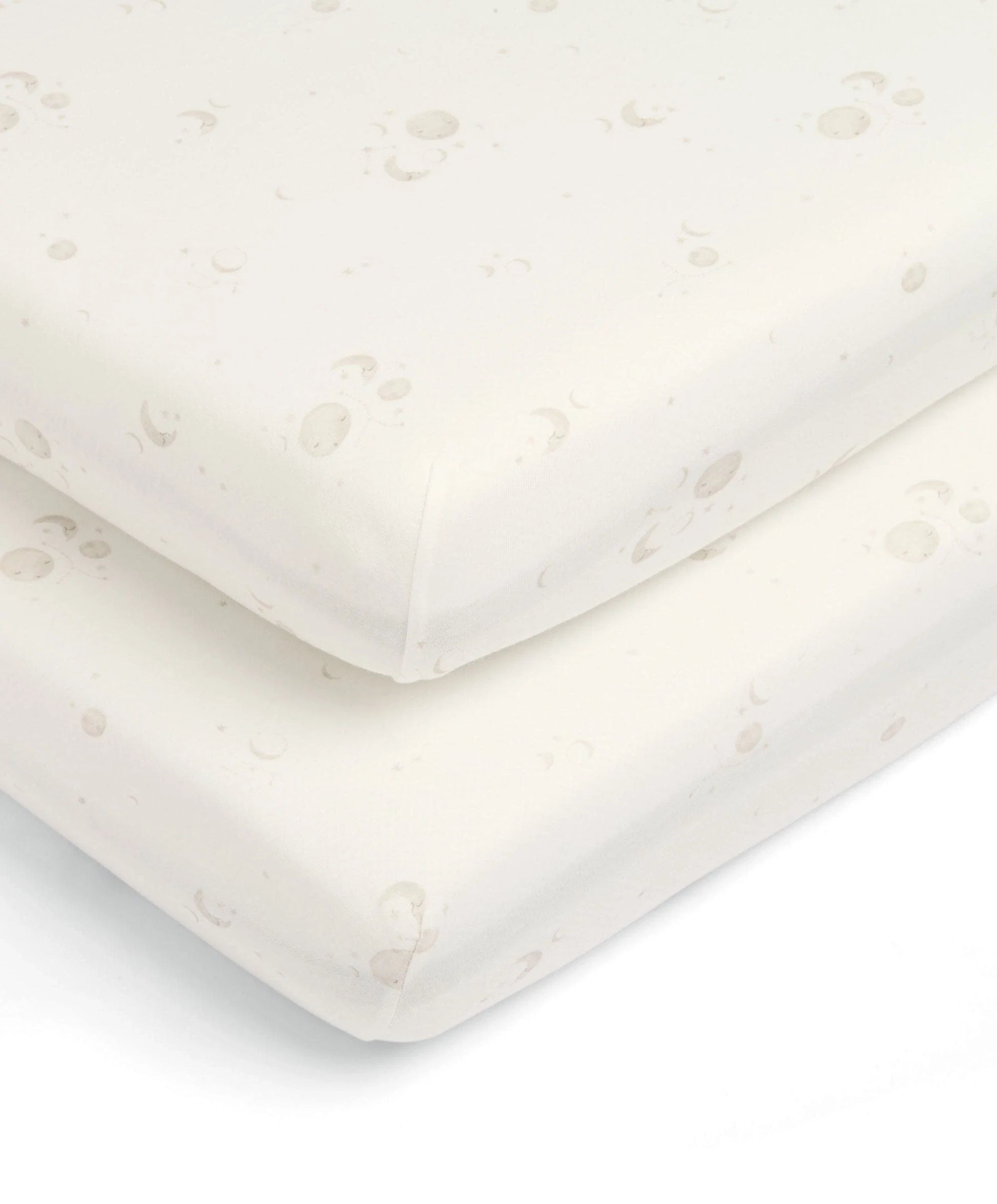White cot fitted sheet corner with celestial dot print and elastic border