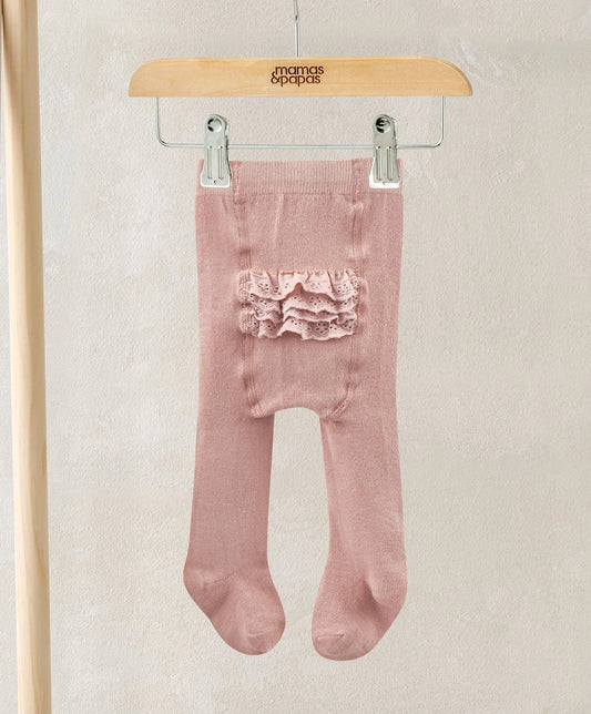 Light pink tights with ruffled bum panel, hanging on clips