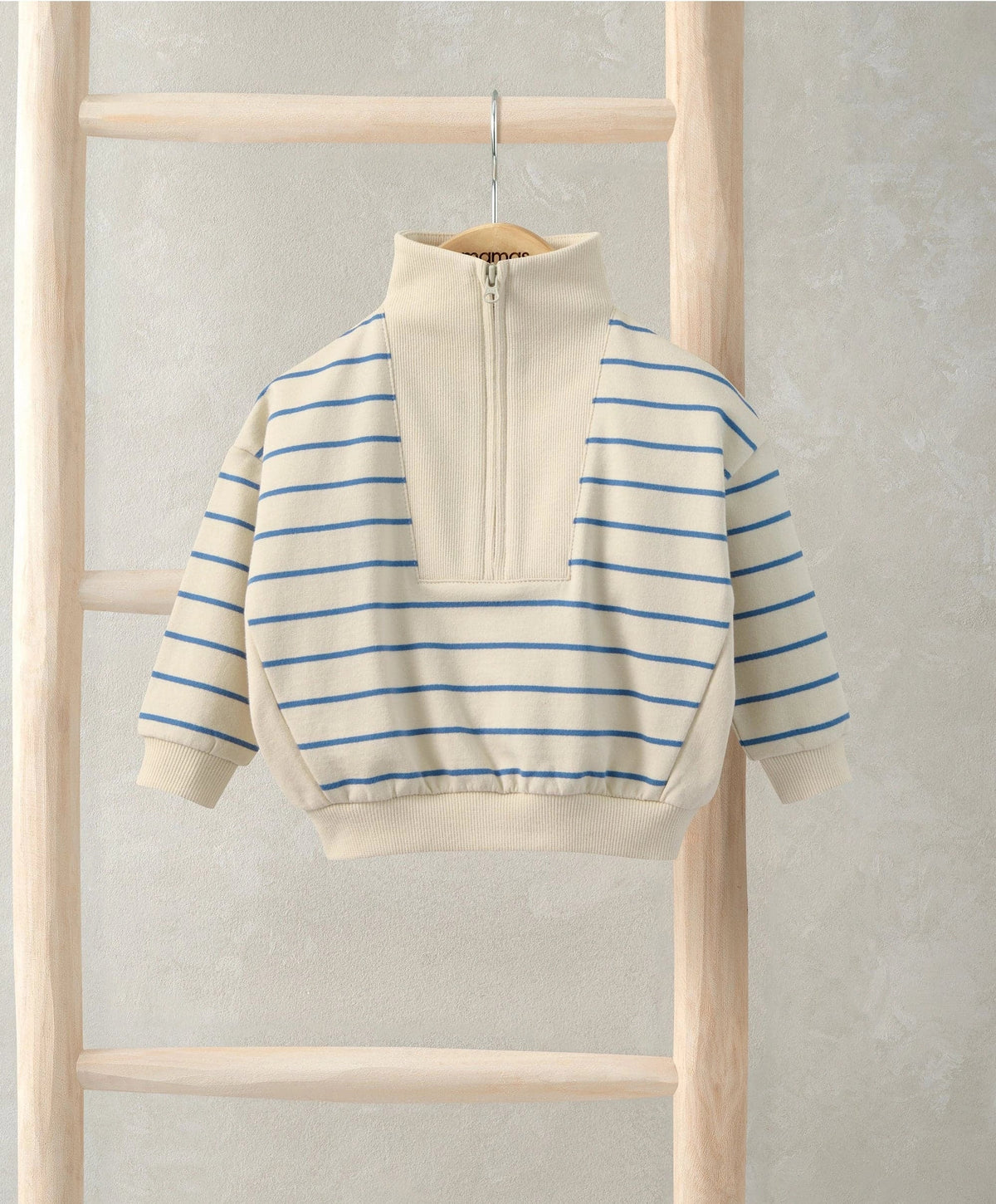 Off-white funnel neck jumper with blue stripe panels and half-zip front