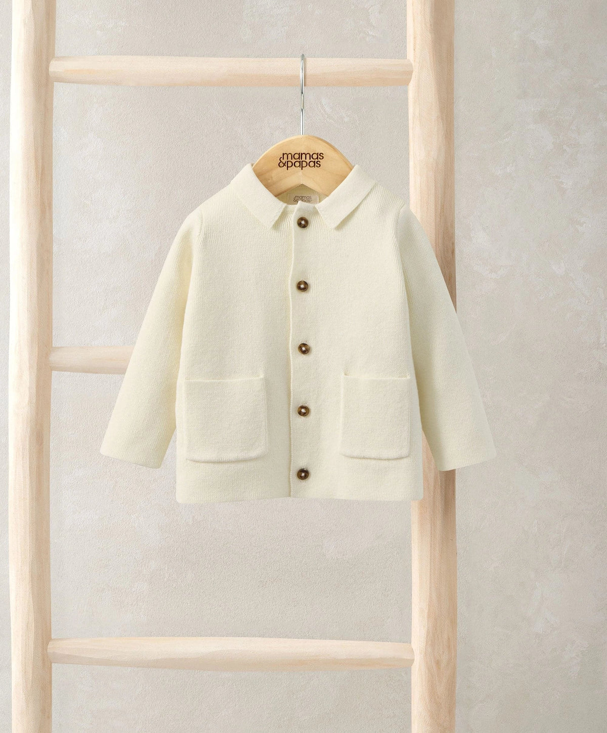 Cream collared knitted cardigan with button front and two front patch pockets