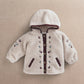 Cream hooded borg jacket with burgundy zipper trim and embroidered sleeve motifs