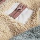 Color-block pramsuit with front zipper and hood, beige, taupe, and dark brown patches