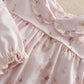 Pale pink floral jersey pyjama dress-style yoke with gathered seams and button detail