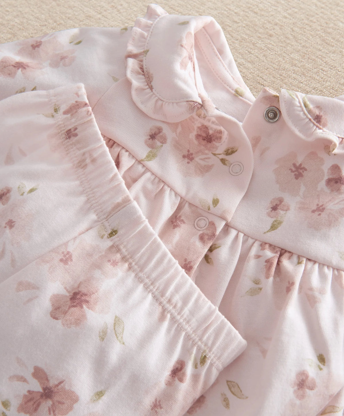 Pale pink floral pyjama top with ruffled collar and button placket, long sleeves