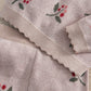Light pink knitted sleeve hem and cuff with berry and leaf print