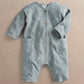 Light blue moon printed long-sleeve romper with button placket and front pockets